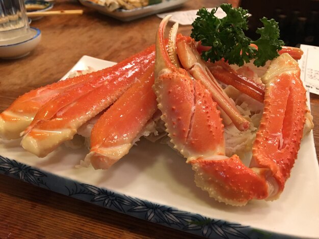 Close-up of fresh fish in plate on table