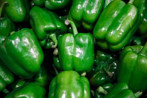 Close up fresh green peppers background