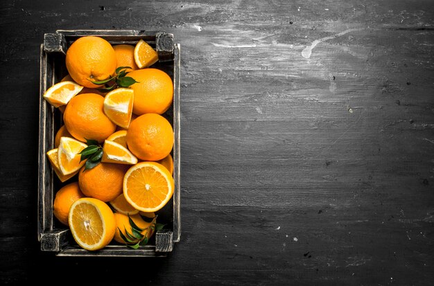 Close up on fresh oranges in an old box