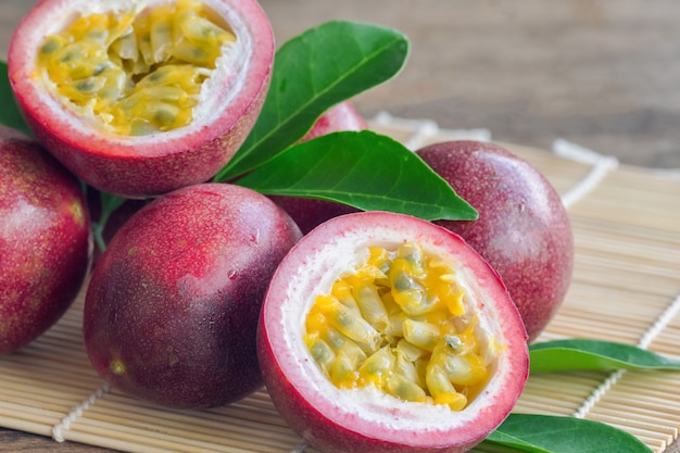 Close up fresh passion fruit on wood table in side view. Passion fruit is popular tropical