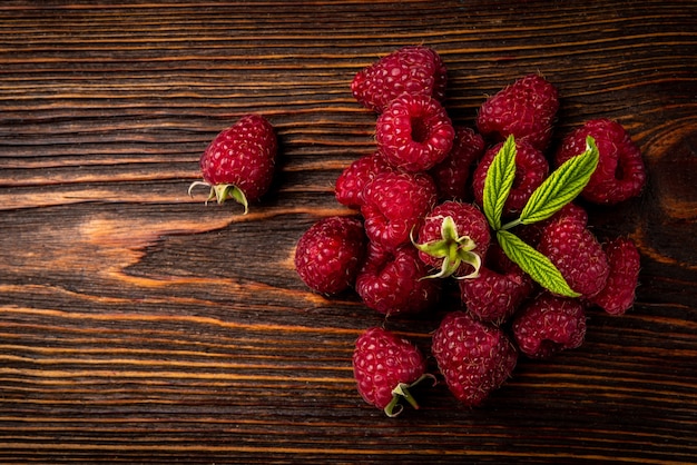 Close up on fresh raspberry pile on table