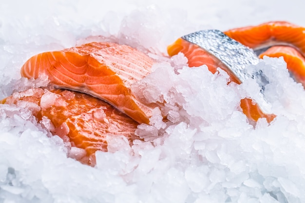 Close-up Fresh raw salmon fillets on Ice.