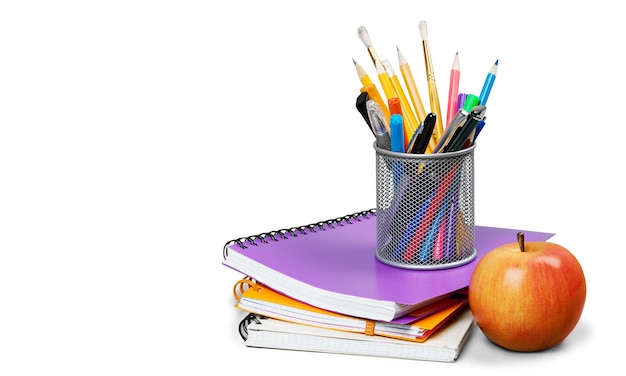 Photo close-up of fresh red apple with notebooks on background