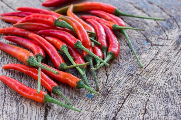 Close up fresh red chili on old wooden