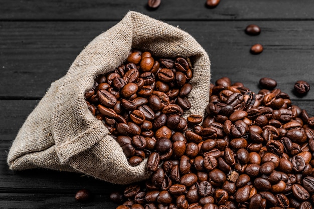 Close-up fresh roasted coffee beans in bag.