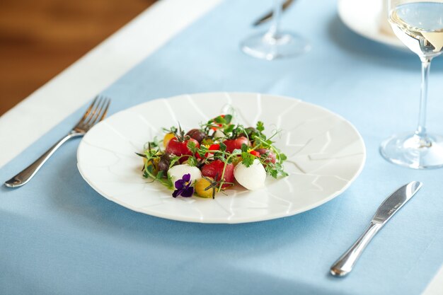 Close-up of fresh tomato salad with herbs