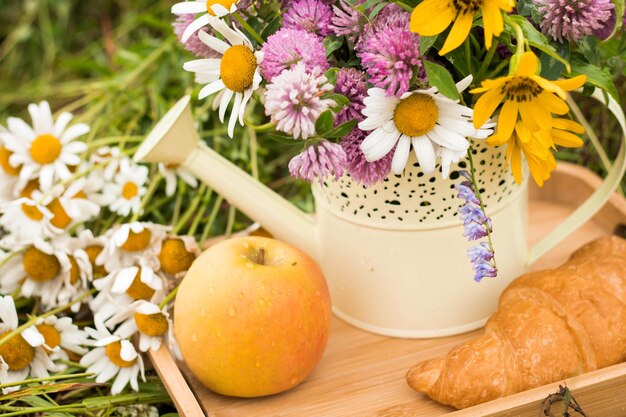 Close-up of fresh yellow flowers in vase on table