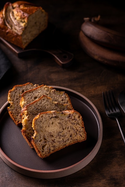 Close up of freshly baked banana bread on a wooden table