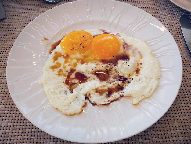 close-up of fried egg served on plate