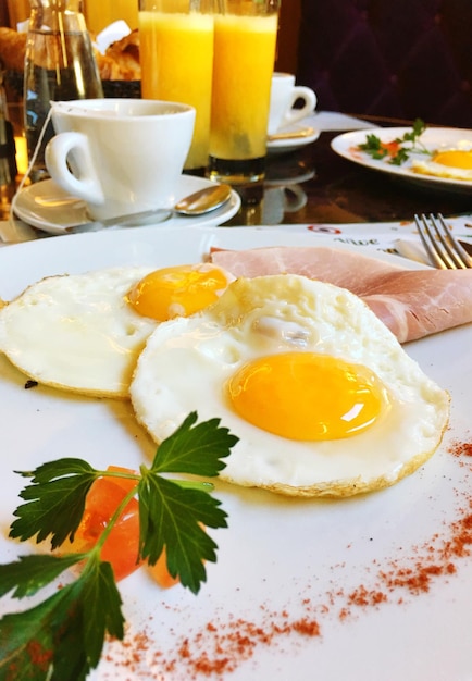 Close-up of fried egg served on table