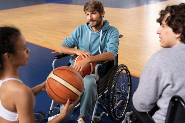 Close up friends playing basketball together