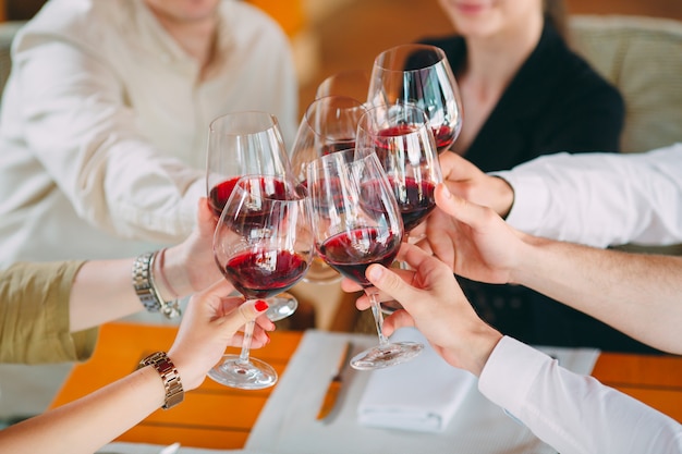 Close-up Of Friends Toasting Wineglasses At Party