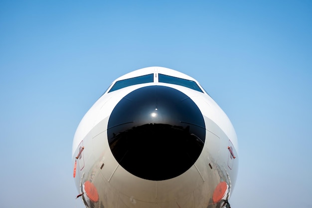 Close up front view of airplane parking at airport