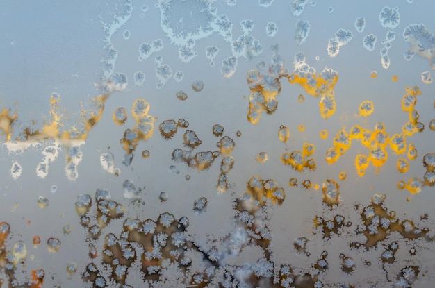 A close up of a frosty window with the word ice on it