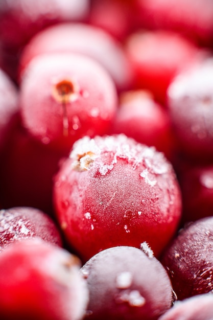 Close up frozen cranberries in a wooden bowl  Selective focus  