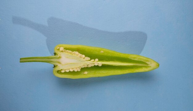 Close up of frsh green chilli peppers on tabel