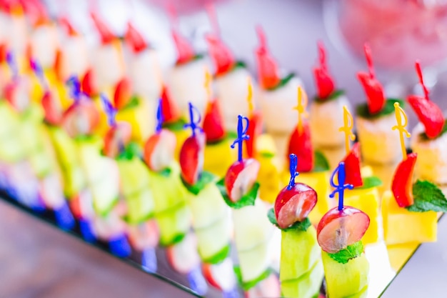 Close up fruit slicing on a transparent stand wedding banquet