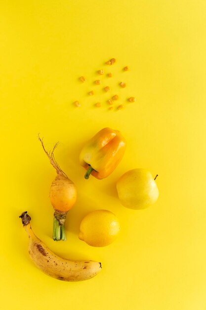 Close-up of fruits against yellow background