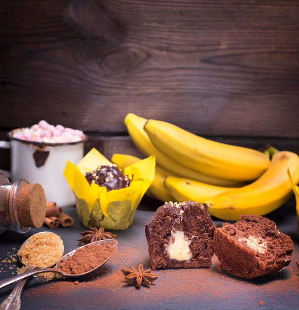 close-up of fruits cupcakes and bananas on table