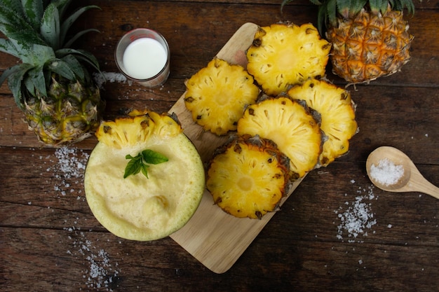 Close-up of fruits on cutting board over table