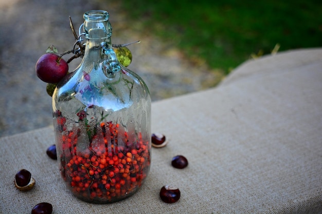 Close-up of fruits in glass jar on table