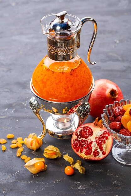 Close-up of fruits in glass jar on table