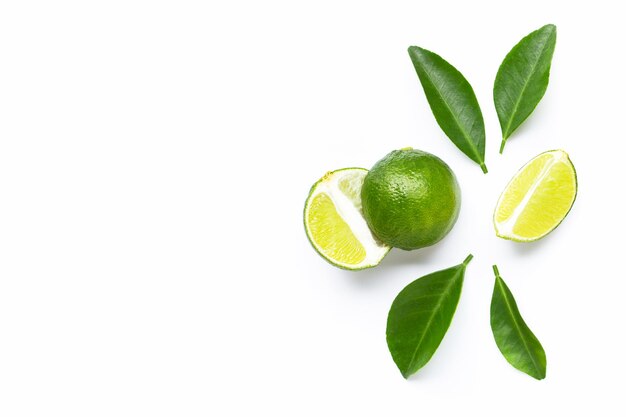 Close-up of fruits and leaves against white background