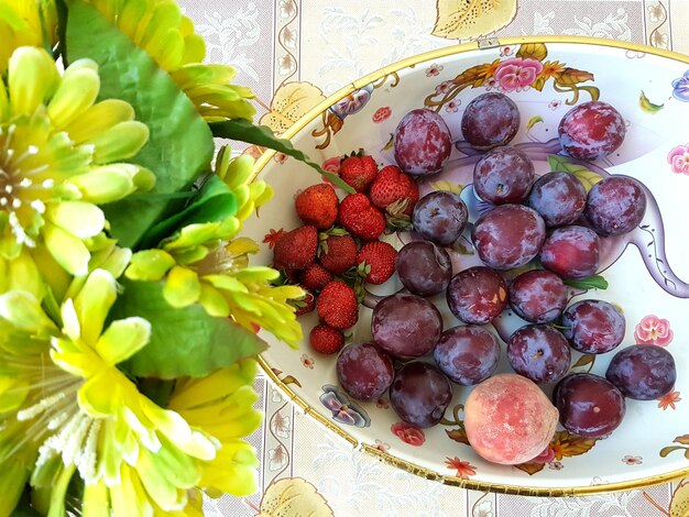 Close-up of fruits in plate on table