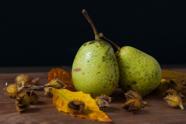 Photo close-up of fruits on table against black background