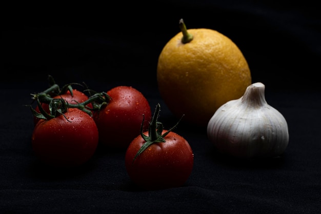 Close-up of fruits on table against black background