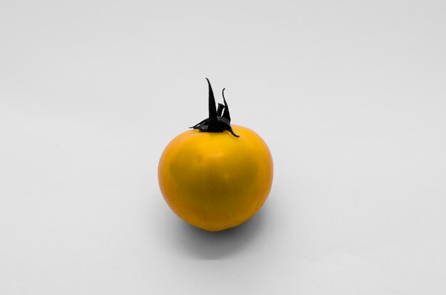 Close-up of fruits over white background