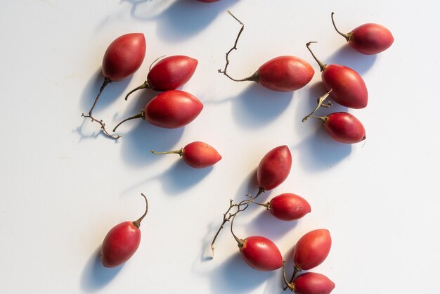 Close-up of fruits over white background