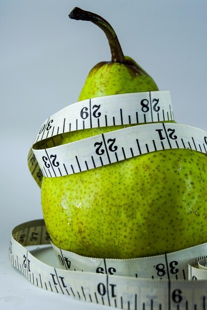 Close-up of fruits over white background