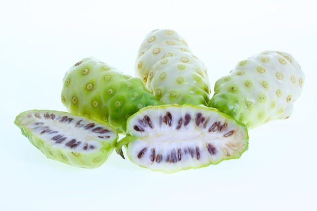 Close-up of fruits over white background