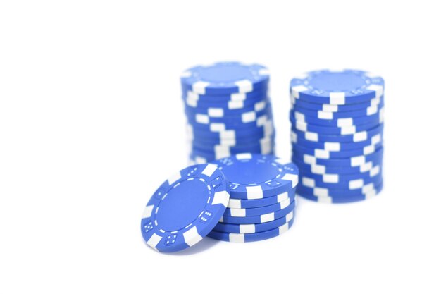 Photo close-up of gambling chips against white background