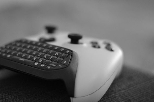 Photo close-up of game controller on seat