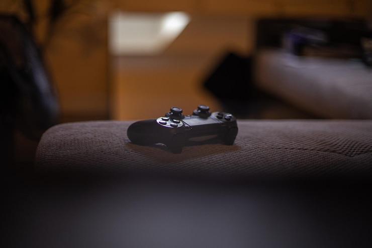 Photo close-up of game controller on table at home