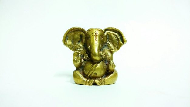 Photo close-up of ganesha figurine against white background