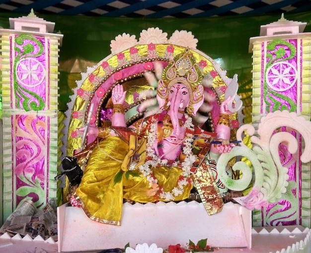 Close-up of ganesha statue on table