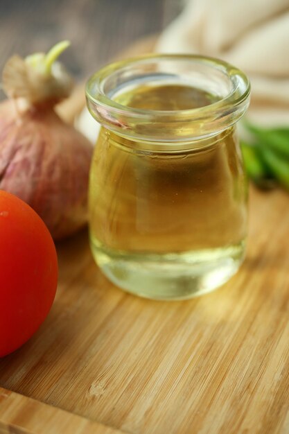 Close up of garlic tomato and olive oil on table