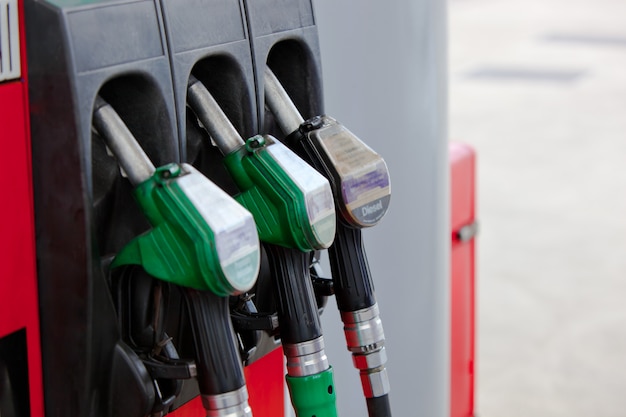 Close-up of a gasoline pumps nozzles in a petrol station