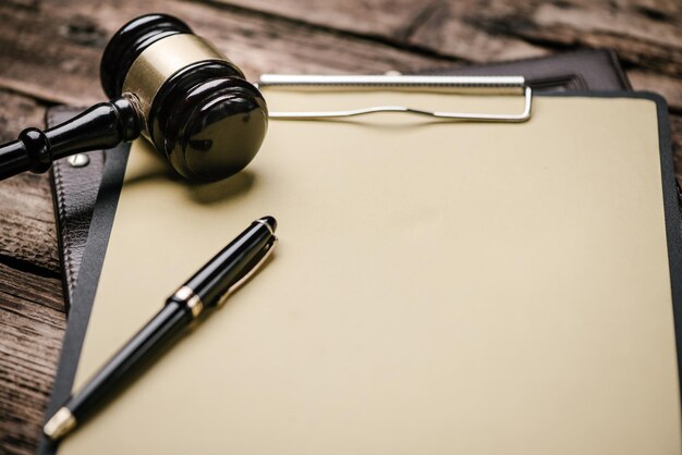 Close up of a Gavel and judgement on desk. Law concept