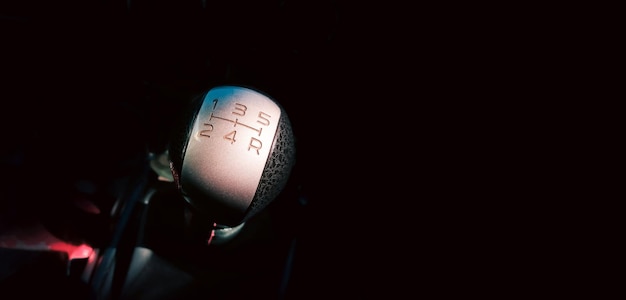 Close up of gear lever or gear stick of sport car 5 speed manual transmission panoramic banner with copy space for text Automotive concept