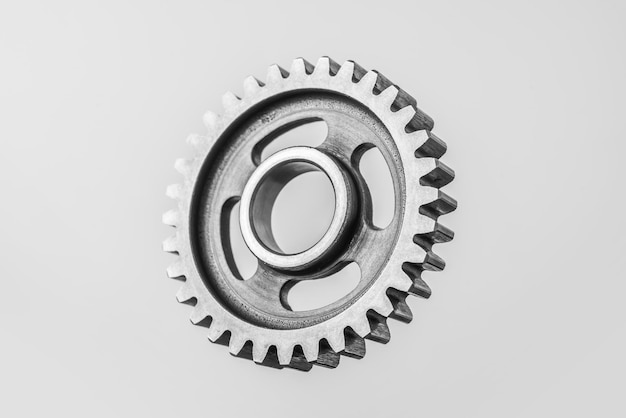 Photo close-up of gear wheel against white background