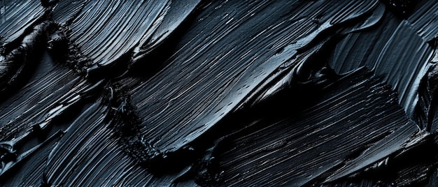 Foto close-up gedetailleerde textuur van zwarte verf die de donkere en gladde eigenschappen ervan benadrukt