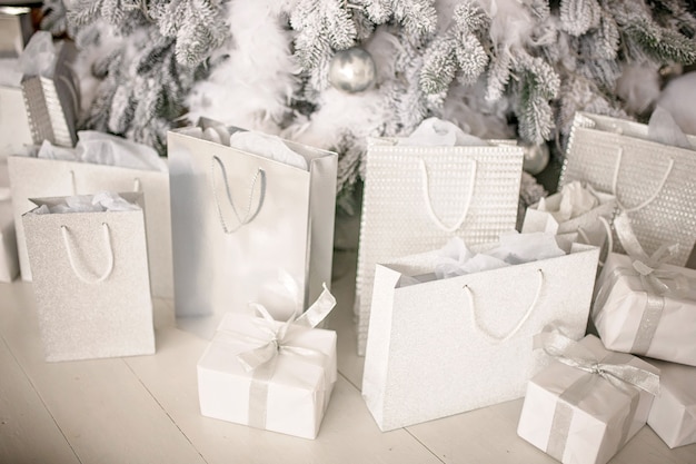 Close up on gift bags under Christmas tree