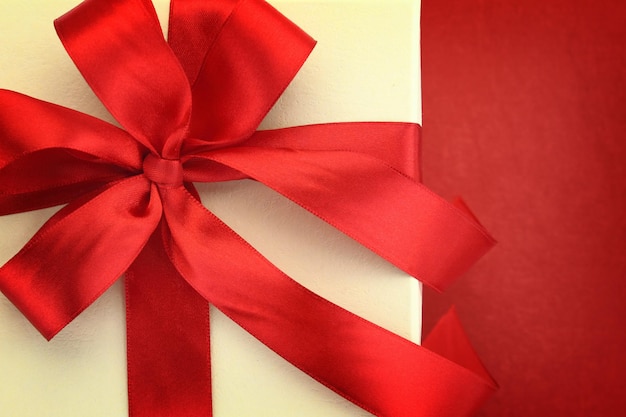Close up of gift box on red background