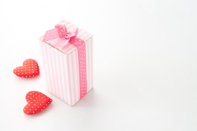 Close up gift box with heart on white background