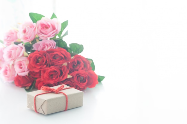 Close up gift box with rose on white background