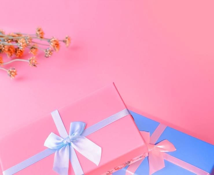 Close up on gift boxes tied with satin ribbons